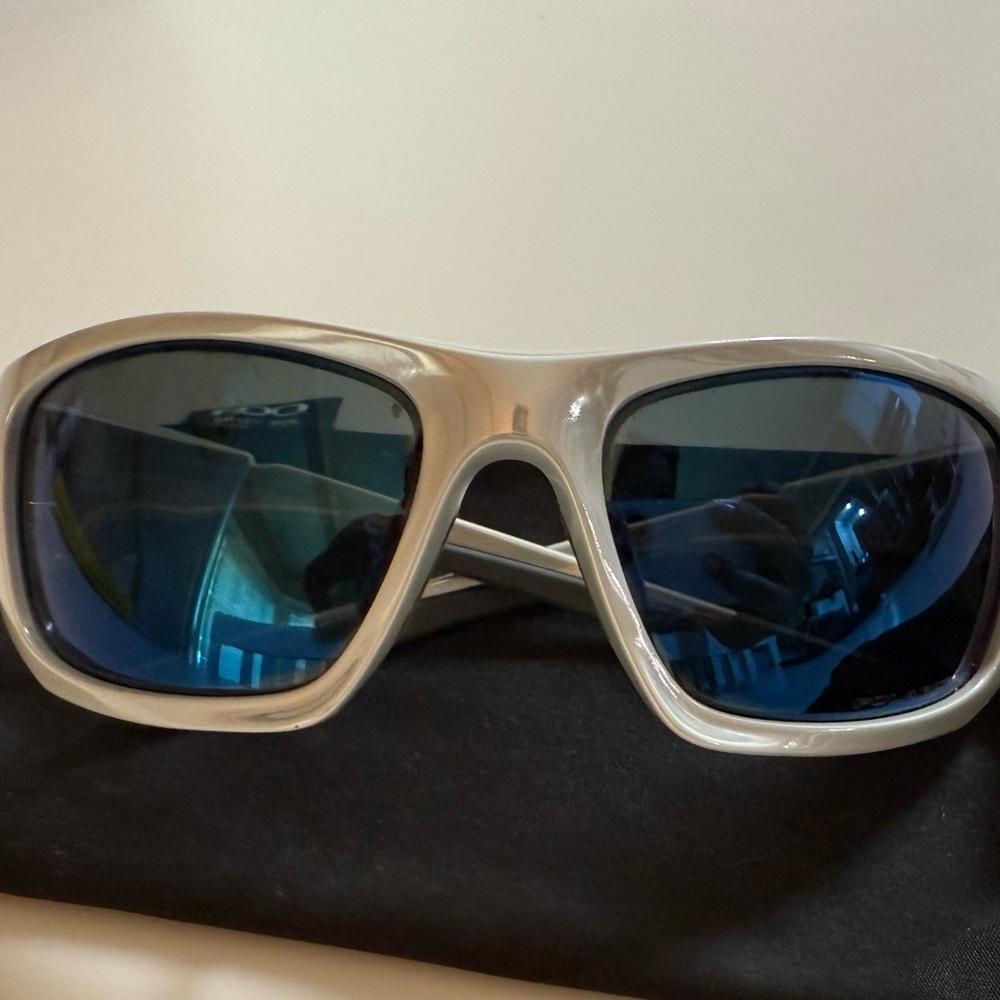 Used Oakley Stylish Silver Sunglasses with Blue Lenses